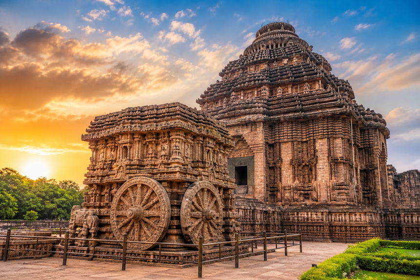 Konark Sun Temple Odisha UNESCO World Heritage Site with stone chariot wheels and intricate carvings at sunset in India